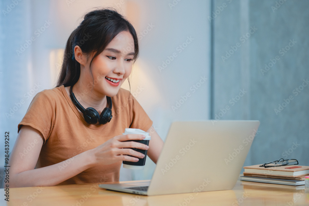 Young woman working or Learning from home. Student woman during E-Learning on laptop at home. Young woman working or Learning from home. Student woman during E-Learning on laptop at home.