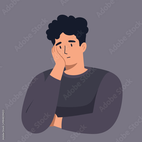 Asian young man with a pensive expression, leaning on his hand against a grey background.