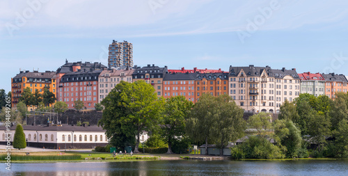 Two skyscrapers, Norra Tornen, built by Oscar properties, the colorful apartment houses at the street Rörstrandsgatan, the canal Karlbergskanalen, a sunny summer day in Stockholm