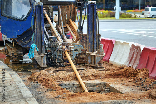 Horizontal directional drilling machine (HDD) in action, using the trenchless method for installing underground utilities such as pipes and cables. Installing pipeline, Selectictive focus