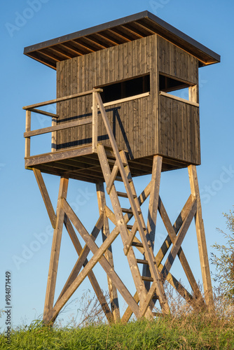 Wildlife observation point - raised blind. Hunting tower. Vertical photos. .