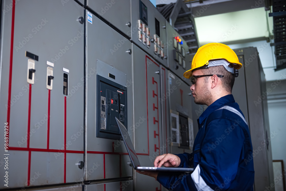 Electrical engineer check the operation of the main electrical control panels and switches, record values on tablets, electrician inspect the electrical systems in the factory. Electrical engineer check the operation of the main electrical control panels and switches, record values on tablets, electrician inspect the electrical systems in the factory.