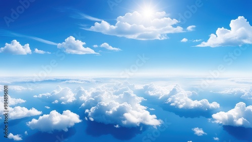 Wallpaper Mural A serene view of a bright sky filled with fluffy clouds above a calm ocean. Torontodigital.ca