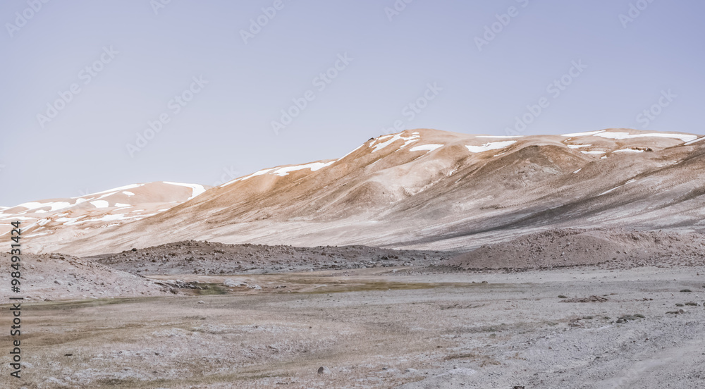 Panoramic landscape of textured Tien Shan mountains in Pamir in Tajikistan, panoramic landscape of a mountain range with snow and glaciers in summer Panoramic landscape of textured Tien Shan mountains in Pamir in Tajikistan, panoramic landscape of a mountain range with snow and glaciers in summer