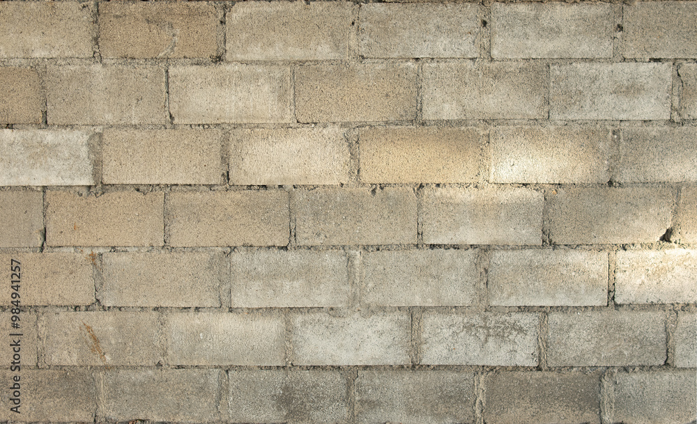 Fototapeta premium A brick wall with a spotlight on it