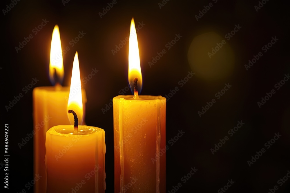 Darkness Illuminated: Burning Candles in a Solemn Ceremony Darkness Illuminated: Burning Candles in a Solemn Ceremony