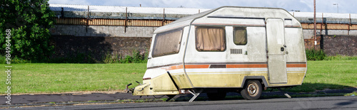 Caravan abandoned and dumped in street waiting to be removed photo