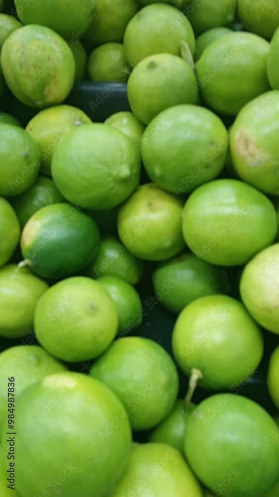 Fresh lemons on a local market shelf. Citrus fruit. Lime sale. Fresh lemons on a local market shelf. Citrus fruit. Lime sale.