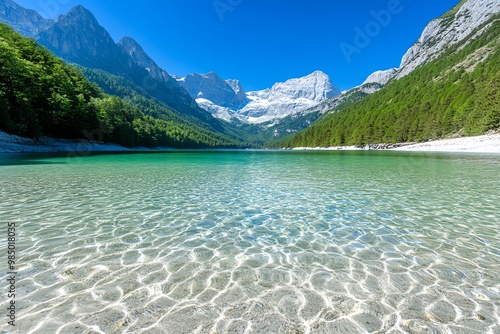 A crystal-clear alpine lake, surrounded by towering mountains and evergreen forests
