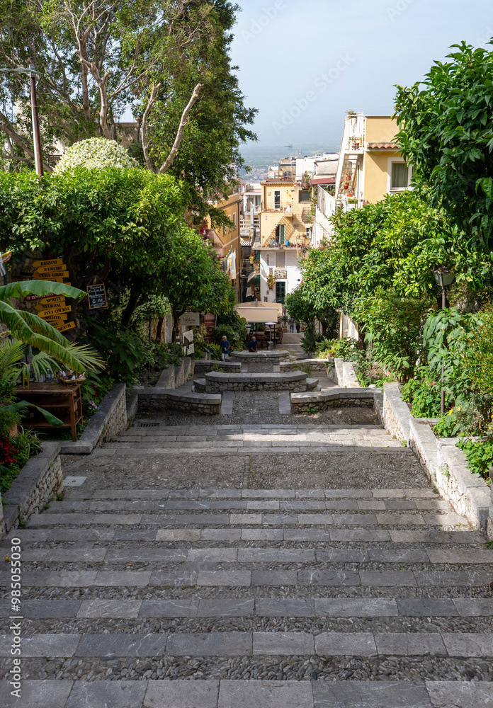 Taormina, Italy - June 19, 2024: Stairs leading down to the town. Taormina, Italy - June 19, 2024: Stairs leading down to the town.