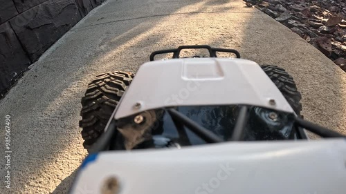 POV Rc car navigating path and grass in outdoor adventure