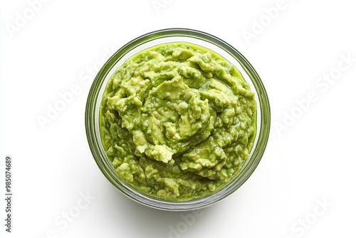 Glass bowl of guacamole on white background. Top view. File contains clipping path.