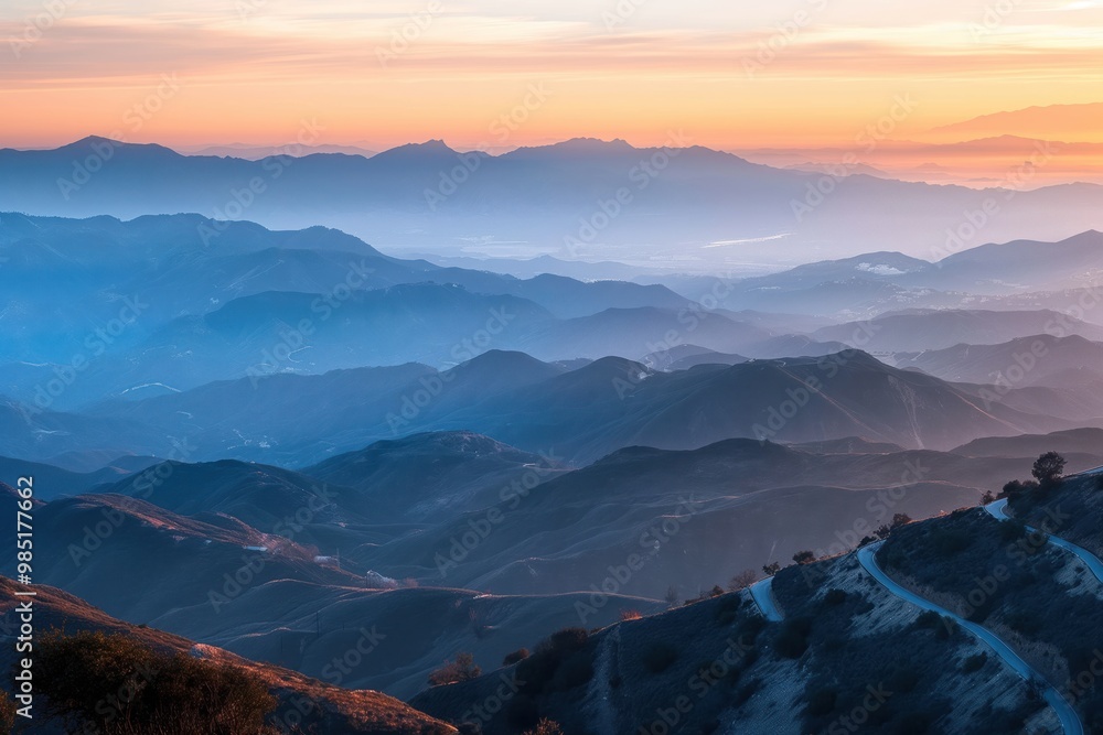 Mountain range at sunset from top angle. Clouds gather above peaks. Scenic landscape with rock formation in background. Natural surroundings, serene atmosphere, summer vibes, outdoor adventure. Mountain range at sunset from top angle. Clouds gather above peaks. Scenic landscape with rock formation in background. Natural surroundings, serene atmosphere, summer vibes, outdoor adventure.