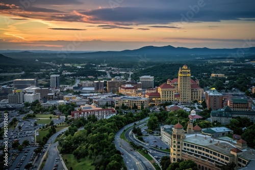 Aerial shot of Roanoke city with beautiful architecture. Cityscape in Virginia features historic buildings, modern skyscrapers, rich green plants. Urban landscape with scenic views of downtown area.