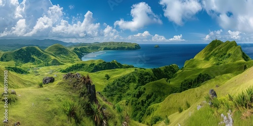 Panoramic landscape of hills overlooking the blue sea in Batanes, Philippines. Rolling green hills meet the sky with lush grass. Scenic countryside with mountainous terrain and distant islands. photo