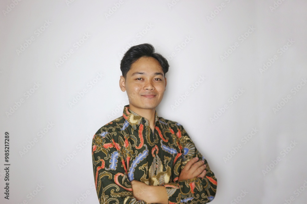 Handsome Indonesian man wearing batik with various expressions isolated white background Handsome Indonesian man wearing batik with various expressions isolated white background