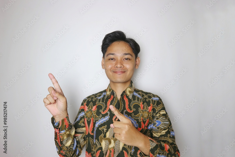 Handsome Indonesian man wearing batik with various expressions isolated white background Handsome Indonesian man wearing batik with various expressions isolated white background