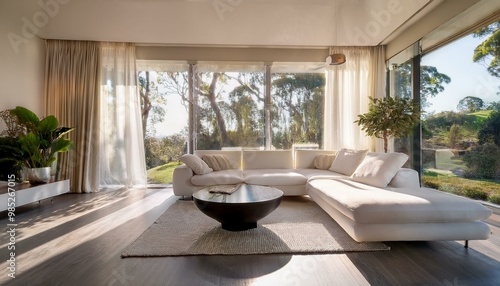  A contemporary villa living room with a sleek, monochromatic design, featuring a modular whi