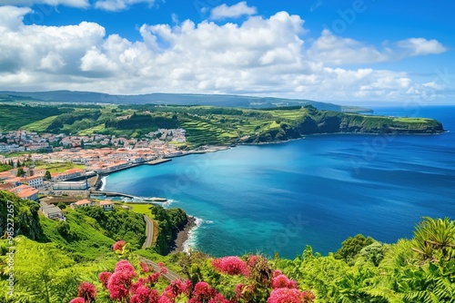 Horta city on Faial island of Azores surrounded by ocean, hills. Beautiful scenery with calm water, green hills. Sunny blue sky with white clouds. Tropical island destination with scenic views,