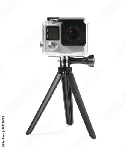 Modern action camera and tripod isolated on white