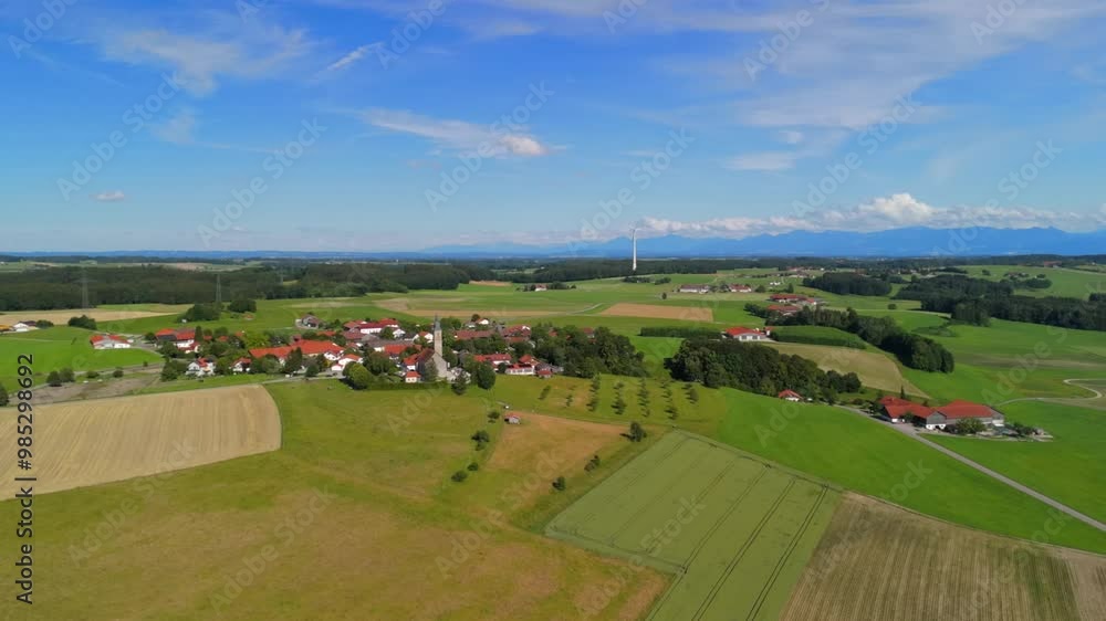 Pfarrkirche St. Michael, Alxing und Windfarm in Bayern, Deutschland Luftaufnahme. Wind turbin behind village church aerial view. Alxing Blick uber Pfarrkirche St. Michael auf Osterklinger Windrad. Pfarrkirche St. Michael, Alxing und Windfarm in Bayern, Deutschland Luftaufnahme. Wind turbin behind village church aerial view. Alxing Blick uber Pfarrkirche St. Michael auf Osterklinger Windrad.