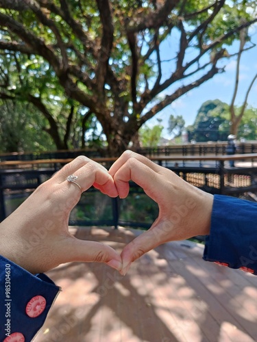 Love hand sign in city park photo