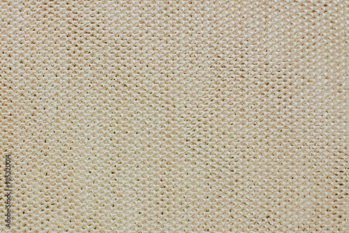 beige rusty background with holes from the kitchen hood filter close-up