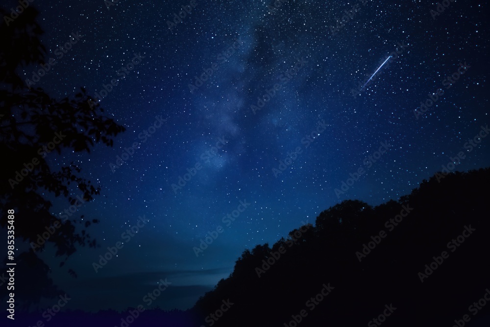 Starry blue night sky with shooting star streaking across. Dark blue background with thousands of twinkling stars, bright glow emanating from distant planet. Beautiful celestial scene, full of Starry blue night sky with shooting star streaking across. Dark blue background with thousands of twinkling stars, bright glow emanating from distant planet. Beautiful celestial scene, full of