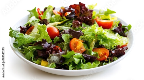 Vibrant salad composition featuring a mix of fresh greens, colorful vegetables, and toppings. The salad includes crisp lettuce, ripe tomatoes, crunchy cucumbers, and a sprinkle of nuts or seeds