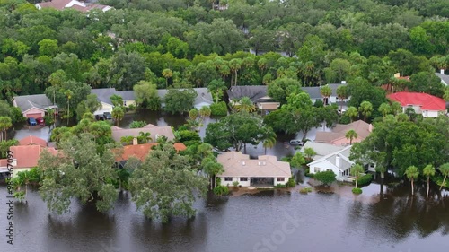 Flooded residential area with underwater houses from hurricane rainfall water in Florida suburban community. Aftermath of natural disaster in southern USA.