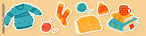 Set of cozy autumn elements: sweater, skein of yarn, wool socks, plaid, knitted hat,books and hot chocolate. Cute scrapbook collection of fall season elements.
