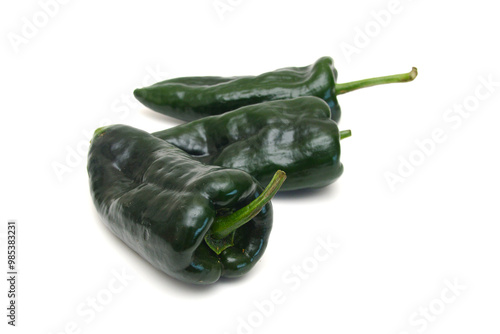 Stack dark green poblano peppers isolated on white photo