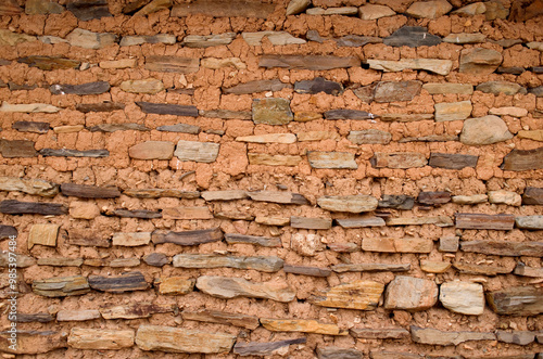 A house wall made of yellow earth and stones at Goseong Hakdong Village near Goseong-gun, South Korea photo