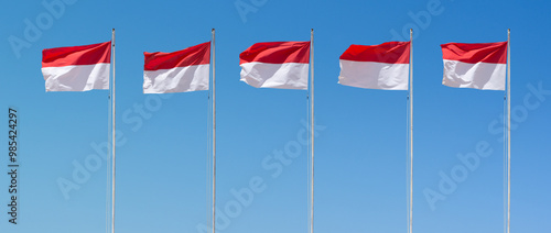 many of Indonesia Flag, Indonesian national flag waving on the flagpole photo