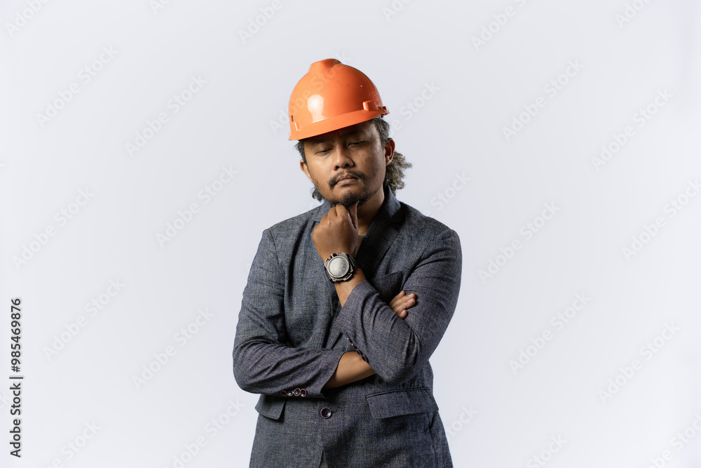 optimistic mens expressions and gestures thinking. stylish asian man with suit and orange helmet on white background. construction or mining business concept photo optimistic mens expressions and gestures thinking. stylish asian man with suit and orange helmet on white background. construction or mining business concept photo