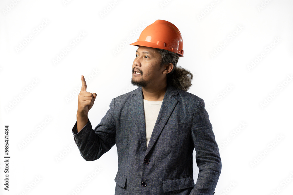 expression of a boss's unacceptability, stylish asian man with suit and orange helmet on white background. construction or mining business concept photo expression of a boss's unacceptability, stylish asian man with suit and orange helmet on white background. construction or mining business concept photo
