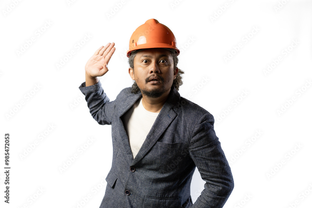 expression of a boss's unacceptability, stylish asian man with suit and orange helmet on white background. construction or mining business concept photo expression of a boss's unacceptability, stylish asian man with suit and orange helmet on white background. construction or mining business concept photo