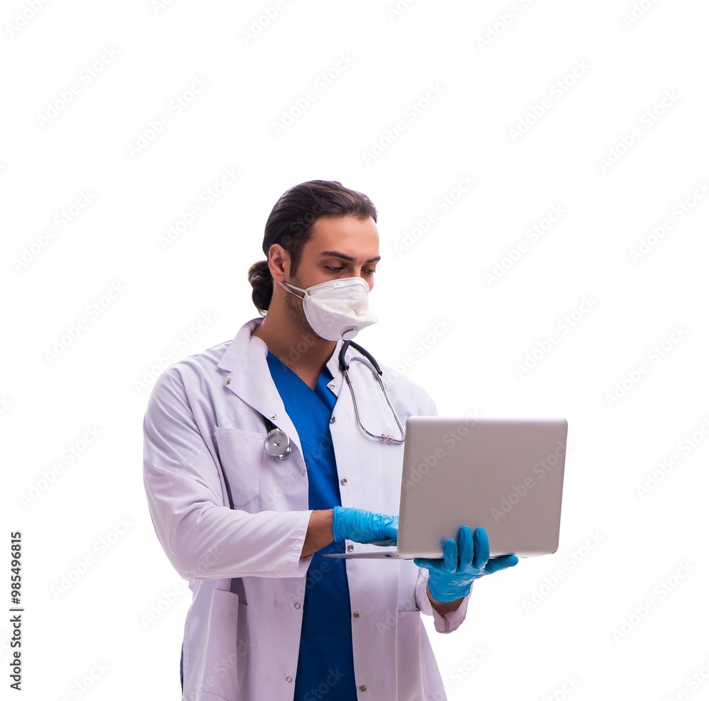 Young male medic in coronavirus concept isolated on white Young male medic in coronavirus concept isolated on white