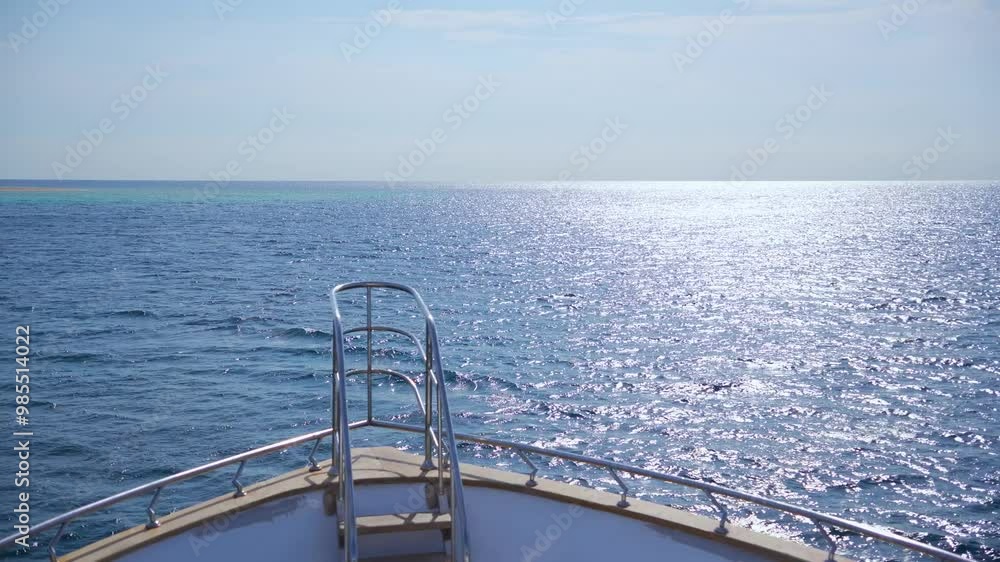 The bow of the yacht floats in the blue waves of the Red Sea, Egypt The bow of the yacht floats in the blue waves of the Red Sea, Egypt
