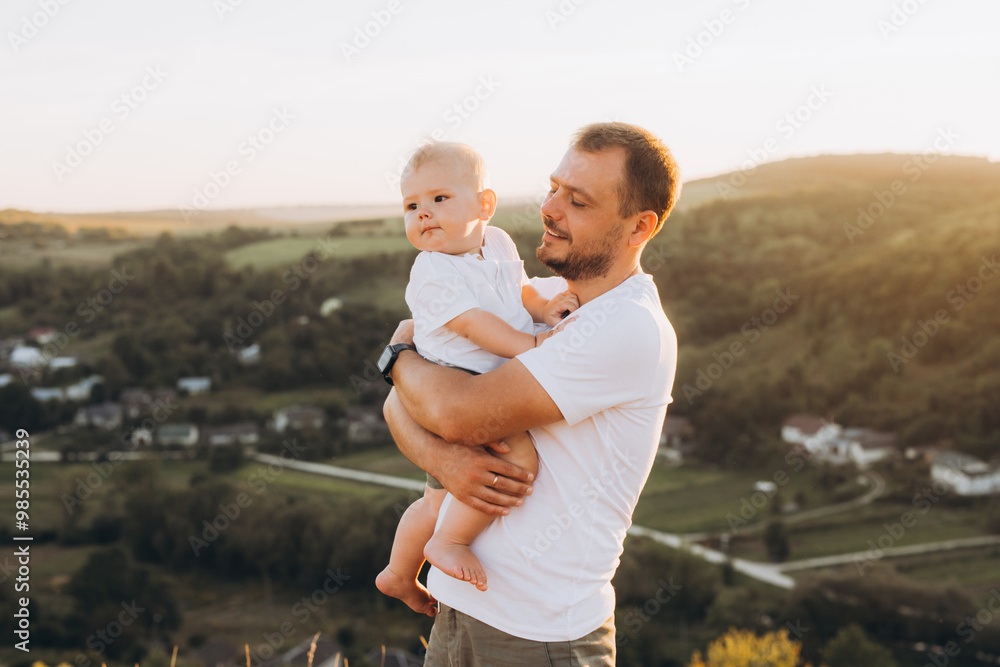 Father Enjoying Scenic View with Baby at Sunset in Countryside Father Enjoying Scenic View with Baby at Sunset in Countryside