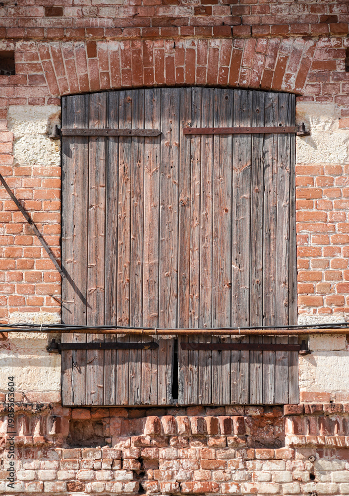 A brick building with a wooden door A brick building with a wooden door