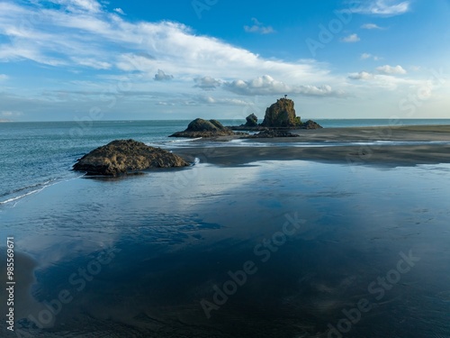 Ocean coastline at the Manuka Harbour entrance. Whatipu, Auckland, New Zealand. photo