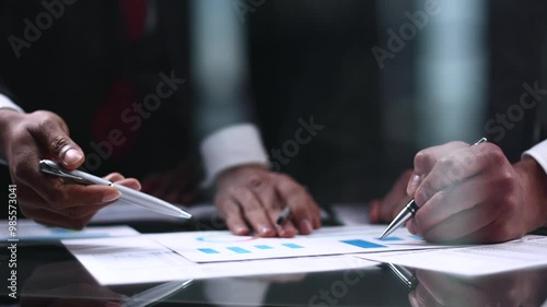 Wallpaper Mural business colleagues look at the graph on the table from above Torontodigital.ca