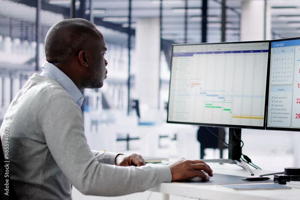 Looking At Agenda Plan On Multiple Screens Looking At Agenda Plan On Multiple Screens