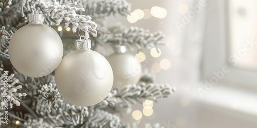 Elegant Christmas Ornaments Hanging on Snowy Tree Branches