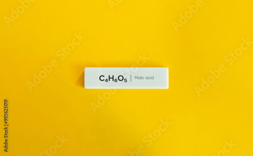 Malic acid, C₄H₆O₅. Molecular or Chemical Formula and Name. photo