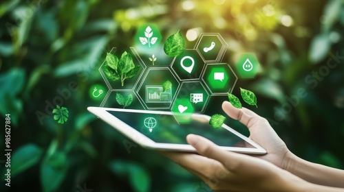 A tablet is being held up to a green background with a variety of icons