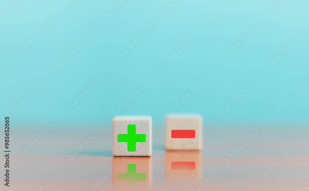 Wooden block shows icons, plus and minus, pros and cons comparison ...