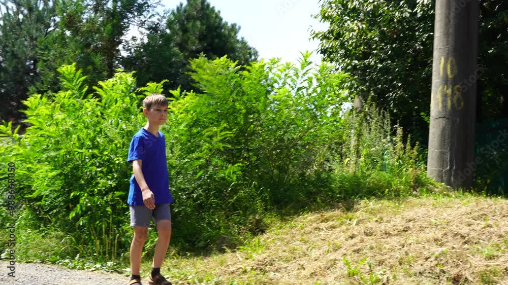 10 years old boy walks around the street