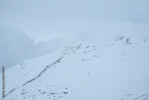 Grindelwald first snow covered summit top. Mountain and hill tops covered in snow near the First cable station in Grindelwald, Switzerland photo